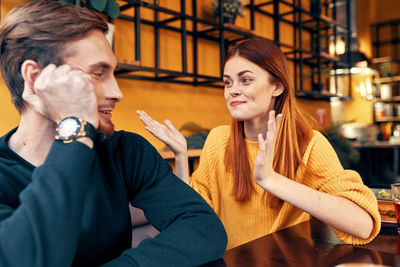 Young couple sitting in restaurant