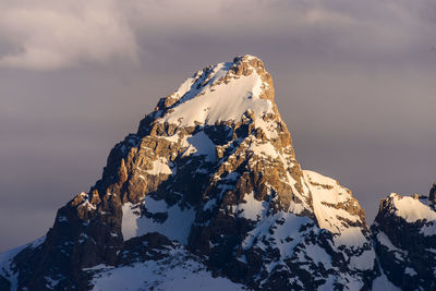 Scenic view of snowcapped mountain against sky during winter