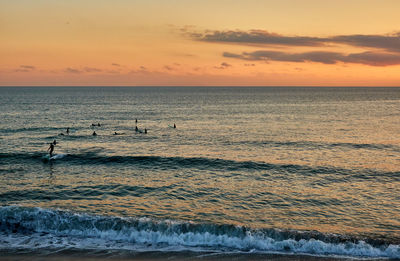 Scenic view of sea against sky during sunset