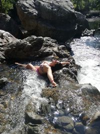 Full length of shirtless man in water