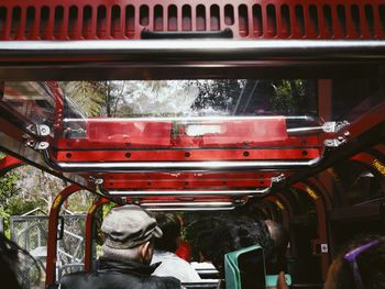 Rear view of man traveling in bus