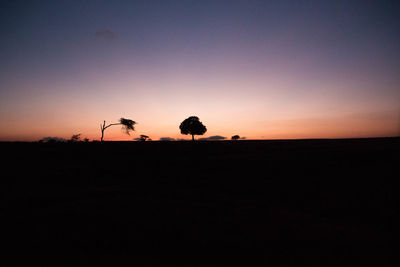 Silhouette horse against sky at sunset