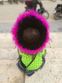High angle view of girl with pink petals