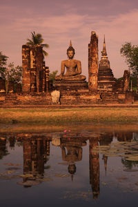 Statue of historic building against sky