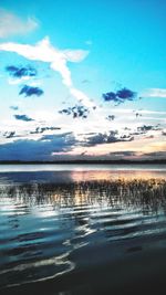 Scenic view of sea against cloudy sky