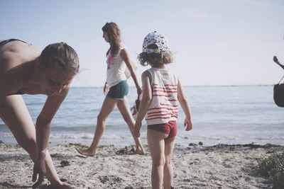 Woman jumping on shore
