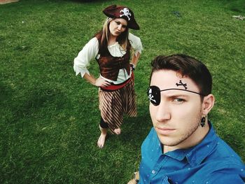 High angle portrait of man and woman in pirate costume