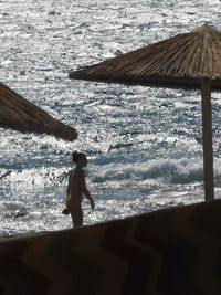 Side view of man standing on beach