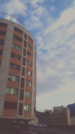 Low angle view of buildings against sky during sunset