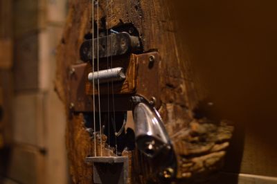 Close-up of damaged guitar