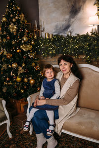 Grandmother and little granddaughter spend time together at christmas time.