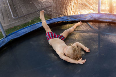 High angle view of woman lying down on floor