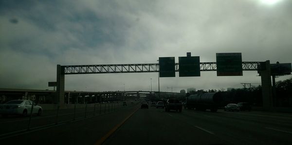 Cars on road against sky