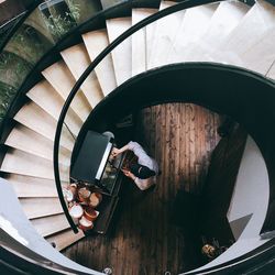 High angle view of person preparing food in restaurant by steps