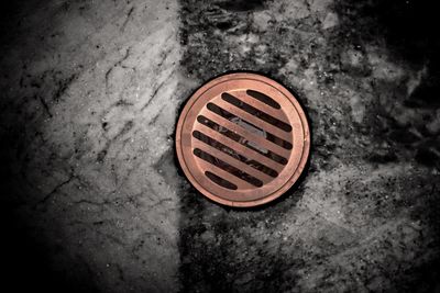 High angle view of manhole on street