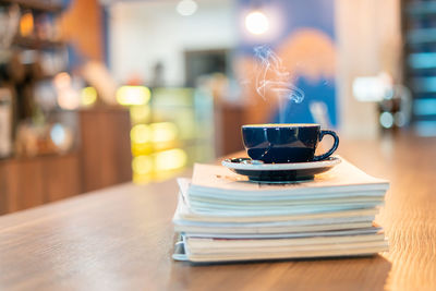 Close-up of coffee cup on table