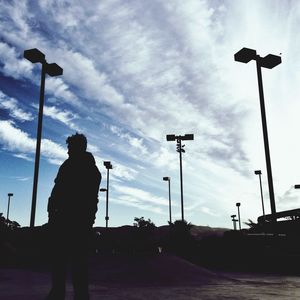 Silhouette of building against cloudy sky