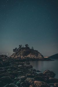 Scenic view of sea against sky at night