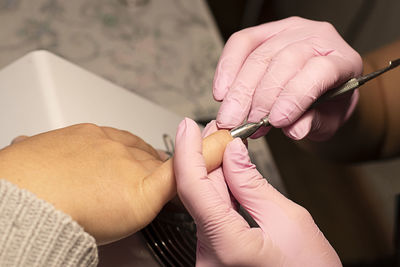 Close-up of woman getting manicure