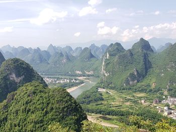 Scenic view of landscape and mountains against sky