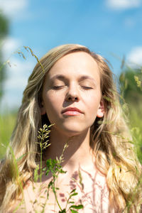 Portrait of young woman with eyes closed