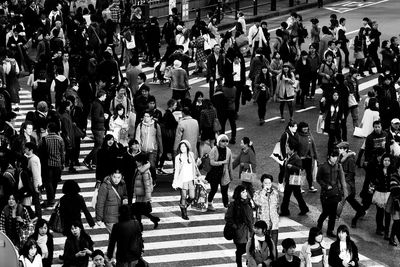 High angle view of people walking in city