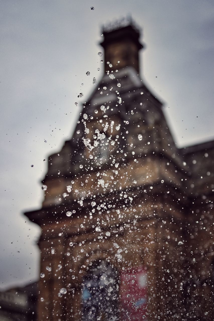 drop, wet, architecture, building exterior, built structure, water, nature, sky, focus on foreground, rain, no people, day, building, window, glass - material, outdoors, transparent, selective focus, rainy season, raindrop, snowing, apartment