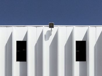 White drying against clear blue sky