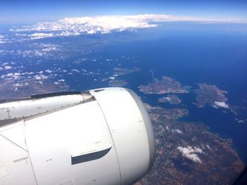 Aerial view of sea seen through airplane window