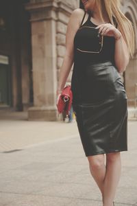 Full length rear view of woman walking outdoors