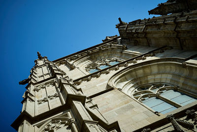 Low angle view of traditional building against clear blue sky