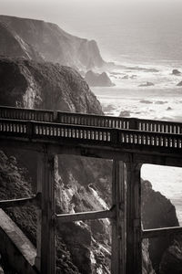 Bridge over sea against sky