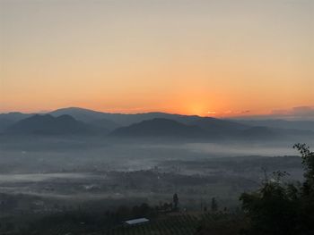 Scenic view of mountains against sky during sunset