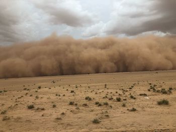 Scenic view of desert against sky