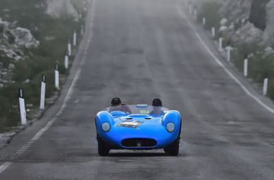 Close-up of vintage car on road