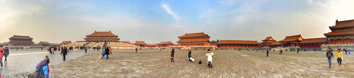 Panoramic view of people at temple against sky