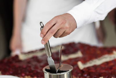 Close-up of man preparing food