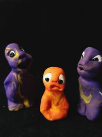 Close-up of stuffed toy against black background