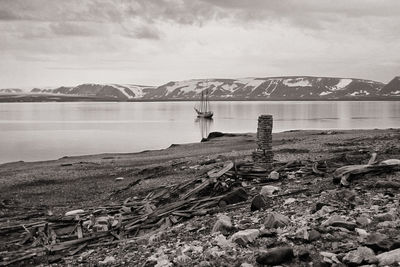 Scenic view of lake against mountain range