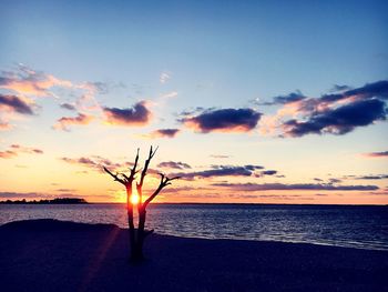 Scenic view of sea against sky at sunset