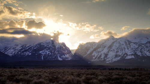 Scenic view of snowcapped mountains against sky