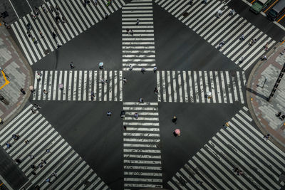 High angle view of crowd crossing road in city