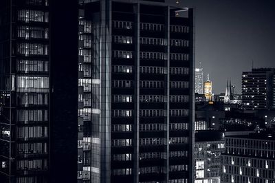 View of buildings in city at night