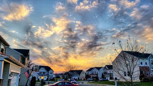 City against sky at sunset