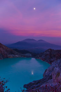 Scenic view of mountains against sky at sunset