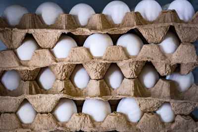 Chicken eggs in cardboard trays close-up
