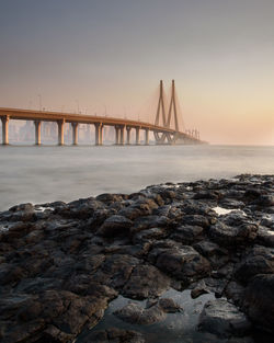 View of suspension bridge over sea