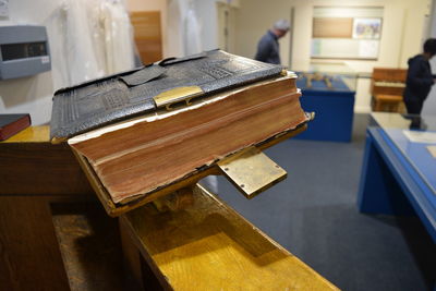 Close-up of bible on table in museum