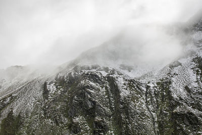 Scenic view of mountains against sky during winter