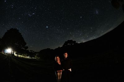 Scenic view of landscape against star field